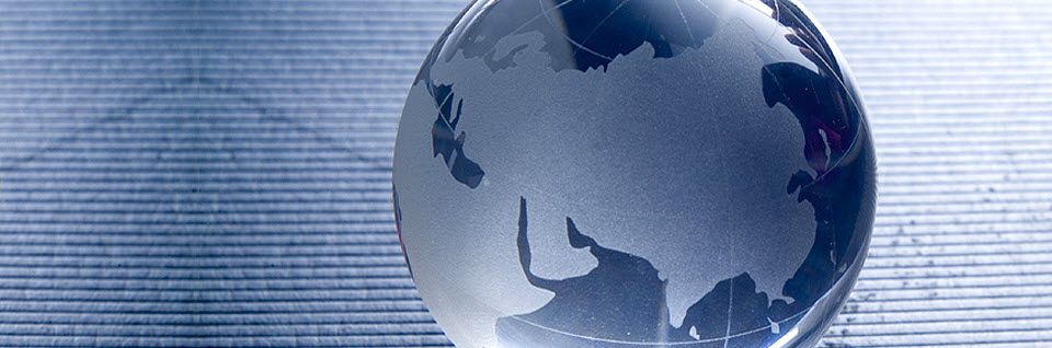 a globe image in blue hue to represent international trading services